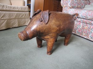 The pig that travelled under Whalley's arm "from London by air / In gay defiance of all airline and government regulations."